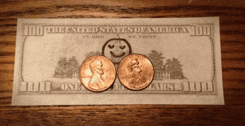 two pennies on top of a one dollar bill