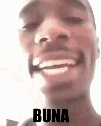 a close up of a man 's face with the word buna written in black .