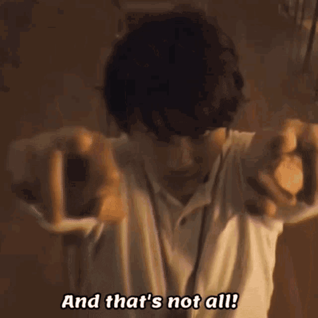 a man in a white shirt is making a funny face with his hands .