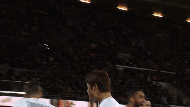 a soccer player wearing a white jersey with the word simon on it
