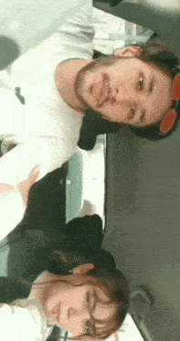 a man and a woman are sitting in a car