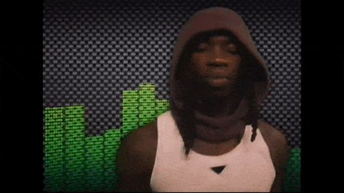 a man wearing a hooded scarf and a white tank top stands in front of a green equalizer