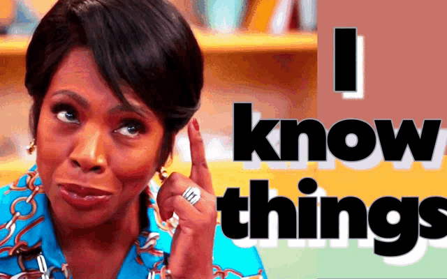 a woman holds her finger to her ear in front of a sign that says ' i know things '