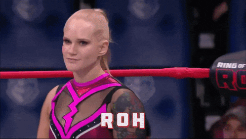 a woman in a wrestling ring with the word roh on the bottom
