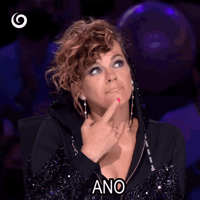 a woman in a black dress says ano in a purple background