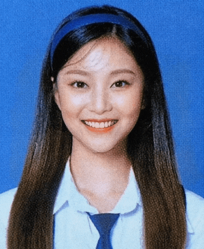 a girl with long hair wearing a white shirt and blue tie