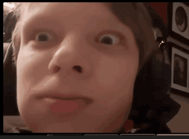 a close up of a person 's face with headphones
