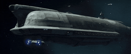a large space ship is flying through the night sky