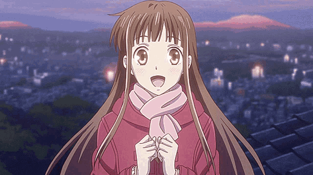 a girl with long brown hair and a pink scarf around her neck