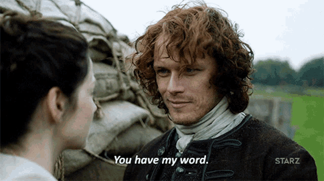 a man and woman are looking at each other and the man is saying you have my word