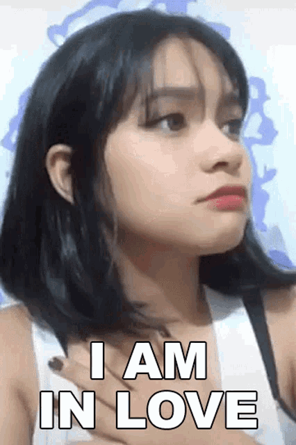 a woman says i am in love on her chest