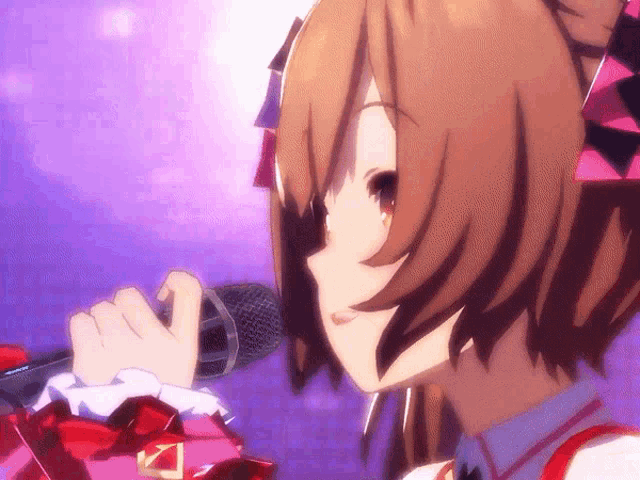 a close up of a girl holding a microphone