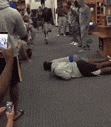 a blurry picture of people standing on a scale