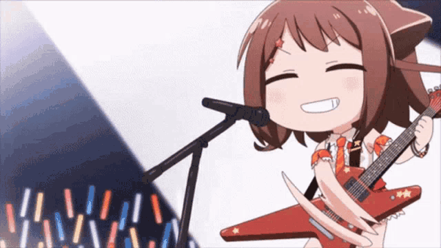 a girl is singing into a microphone while playing a guitar