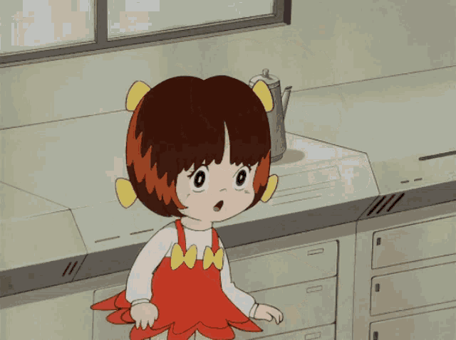 a little girl in a red dress stands in front of a window