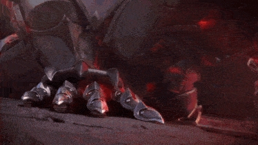 a knight with a crown on his head is laying on the ground