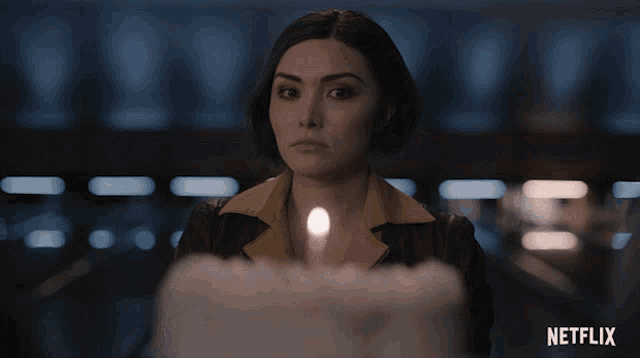 a netflix ad shows a woman with a candle in her hand