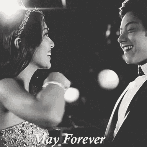 a black and white photo of a man and a woman with the words may forever written below them