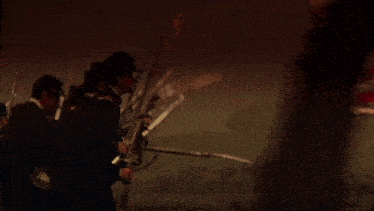 a large american flag is flying in the middle of a battlefield