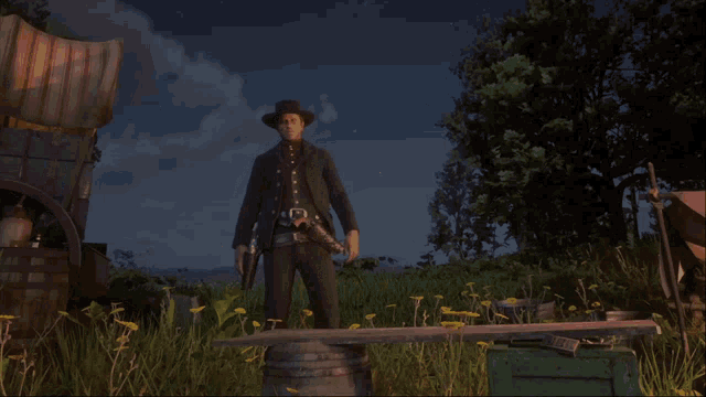 a man standing in a field with a gun