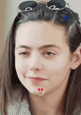 a close up of a woman 's face with a circle around her mouth that says " i love "