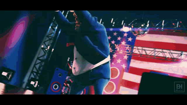a man in a blue suit is jumping in the air