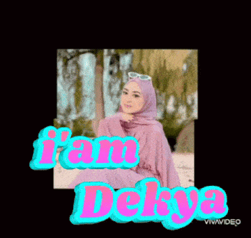 a picture of a woman in a hijab with the words i am dekya