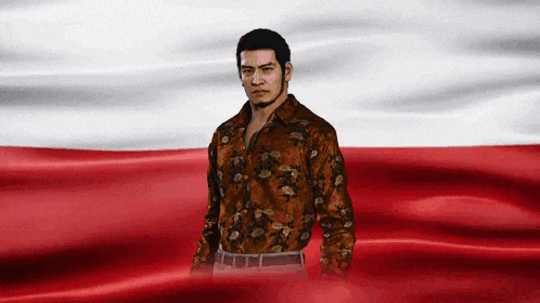 a man stands in front of a red and white flag