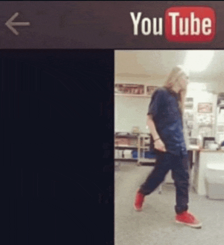 a man is walking in front of a sign that says youtube