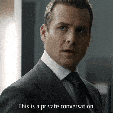 a man in a suit and tie is talking about a private conversation