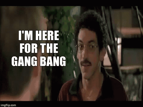 a man with glasses is talking to another man and saying `` i 'm here for the gang bang ''