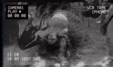 a black and white photo of a woman laying on her back with the date 14.09 1997 at the bottom