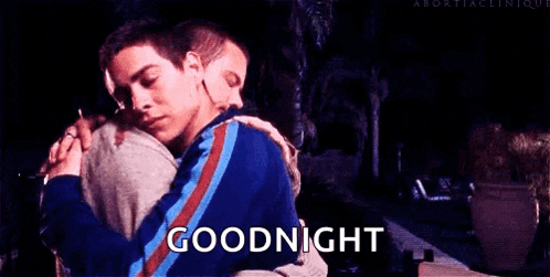 two men are hugging each other and the words `` goodnight '' are written on the bottom .