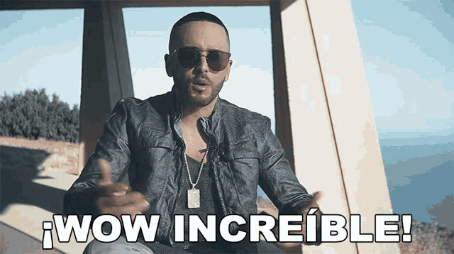 a man wearing sunglasses says wow increible in spanish