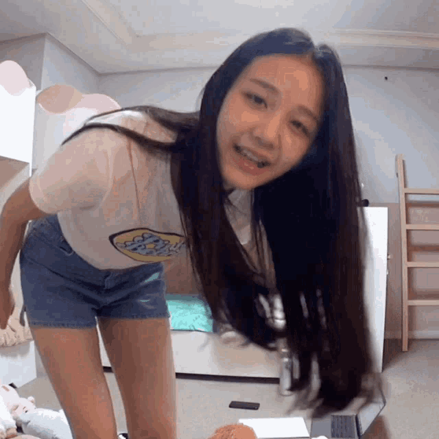 a girl with long hair is wearing a shirt that says snoopy