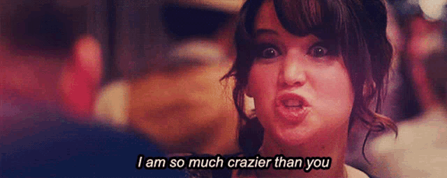 a woman making a funny face with the words i am so much crazier than you above her
