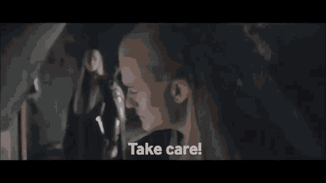 a close up of a person 's face with the words `` take care '' .