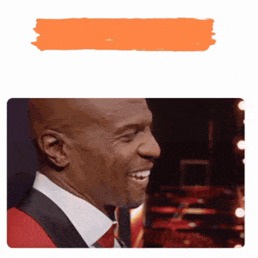 a man in a suit and tie is smiling with an orange border