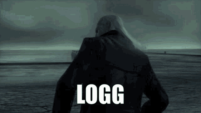 a man in a black jacket with the word logg on the back of his jacket