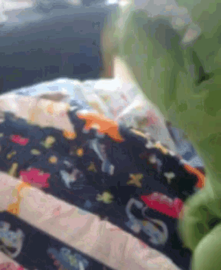 a close up of a bed with a blanket that says space on it