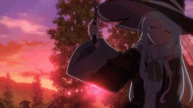 a girl in a witch hat stands in front of a pink and purple sky