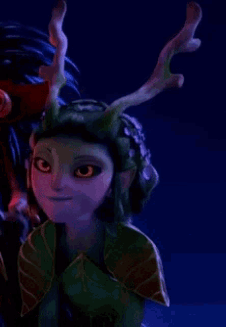 a close up of a cartoon character with antlers on her head and a purple face .