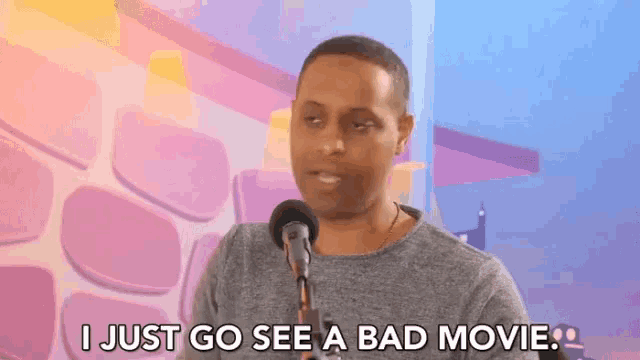 a man is talking into a microphone and says i just go see a bad movie