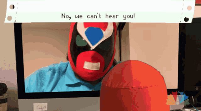 a computer screen shows a superhero with the words " no we can 't hear you " above him