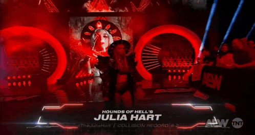 a woman is standing in front of a screen that says hounds of hell 's julia hart on it