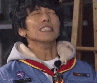 a close up of a person 's face with their eyes closed