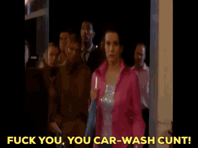 a woman is standing in a restaurant and says fuck you you car wash cunt