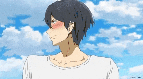 a man with black hair and a white shirt is standing in front of a blue sky and clouds .