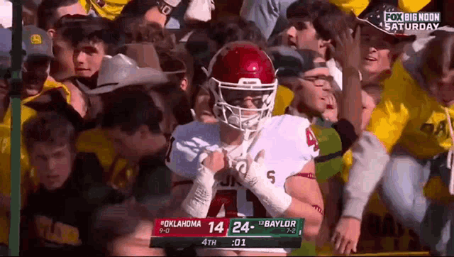 a football game is being played between oklahoma and baylor on saturday