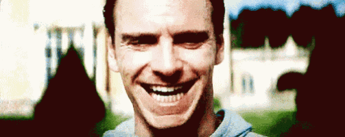 a close up of a man 's face with a smile on his face .